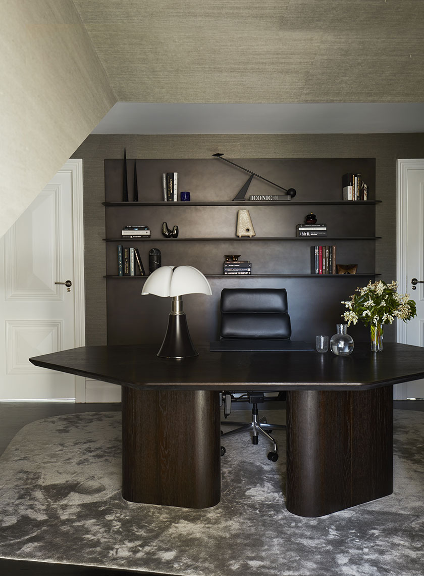 Home Office with Artful Shelving: A sophisticated home office with a dark wood desk, leather chair, and open shelving showcasing curated books and sculptures, part of Residence K, Potts Point. Designed by Nina Maya Interiors.