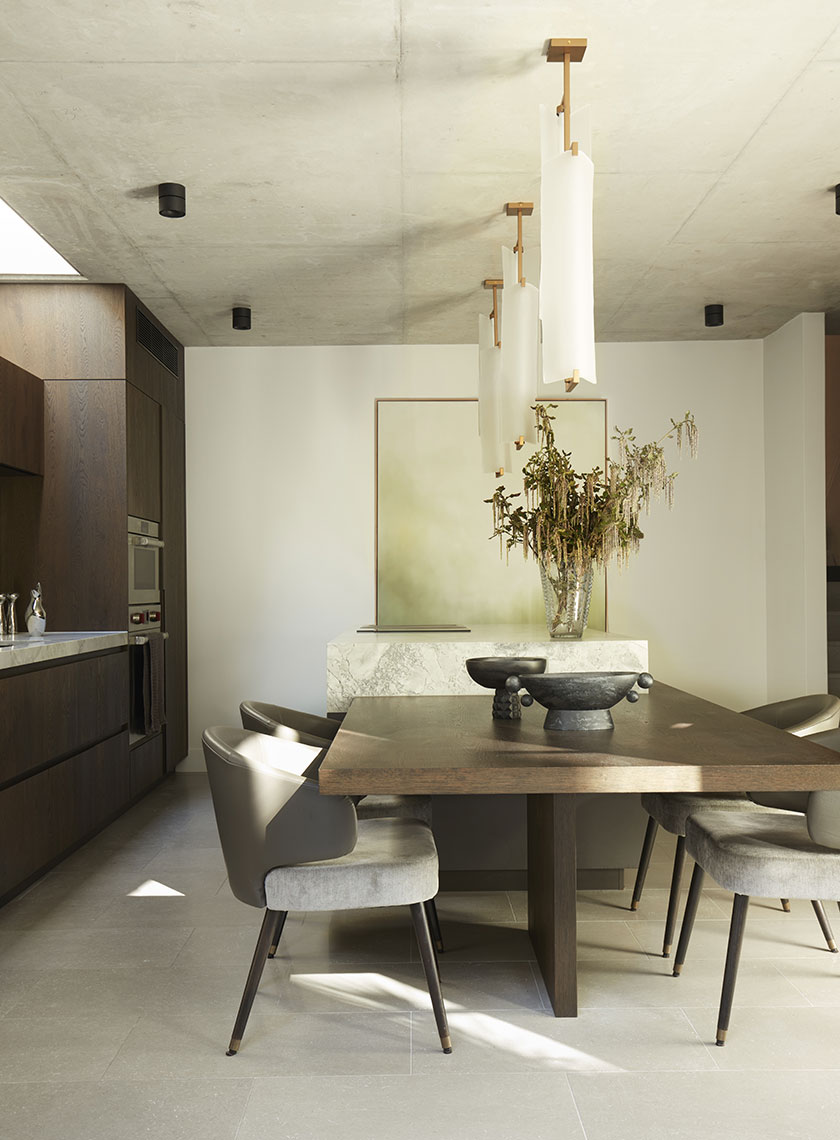 Modern Dining Area with Marble Accents: A contemporary dining room with a marble-topped table, modern lighting fixtures, and minimalist decor. Interior design by Nina Maya Interiors at Residence K, Potts Point.